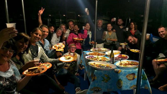Dinner is served as we are treated like royalty on a private boat in the Favignana Harbor. A delicious Sicilian meal